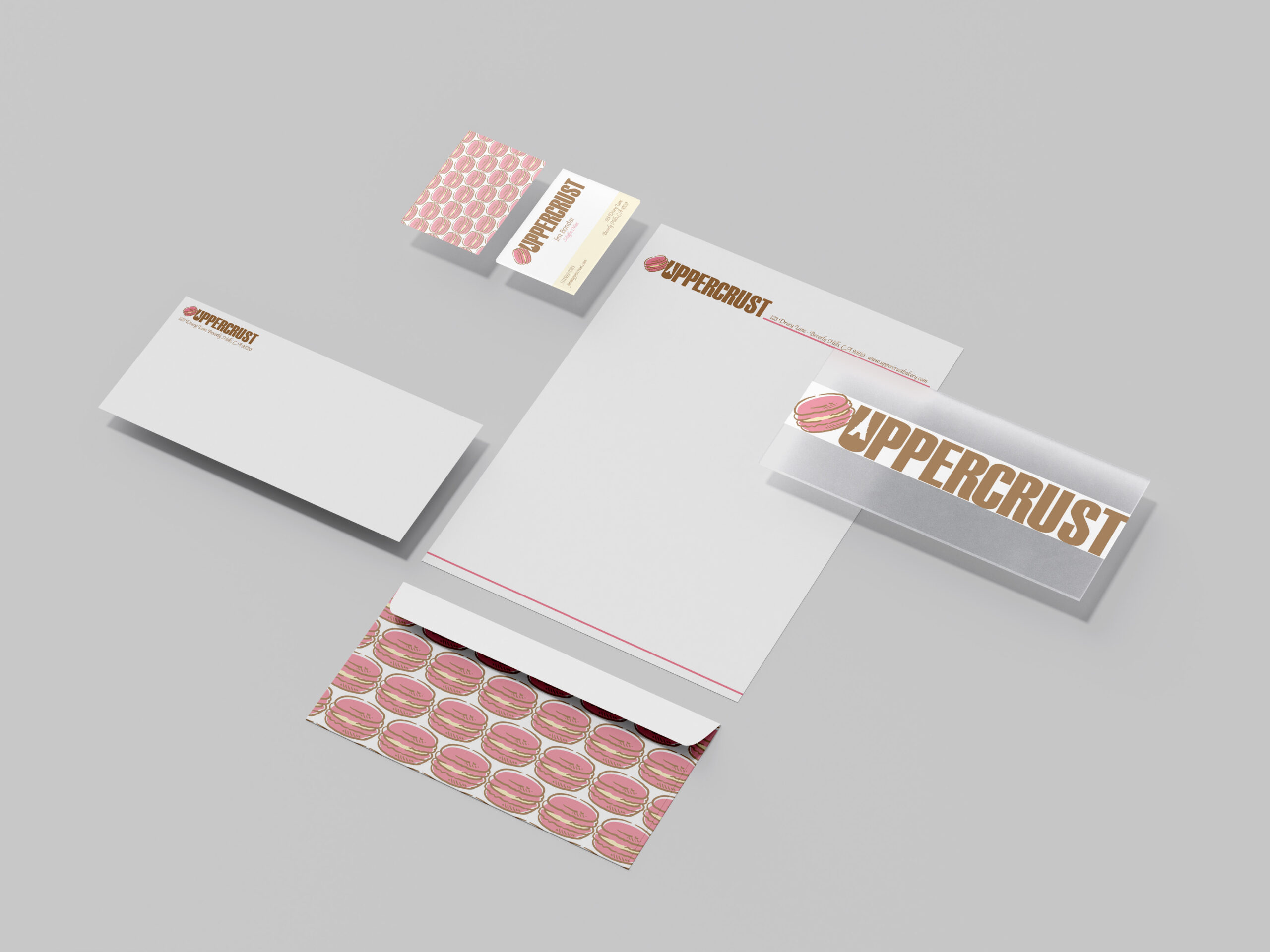 uppercrust bakery mockup including logo, business card, and envelope.