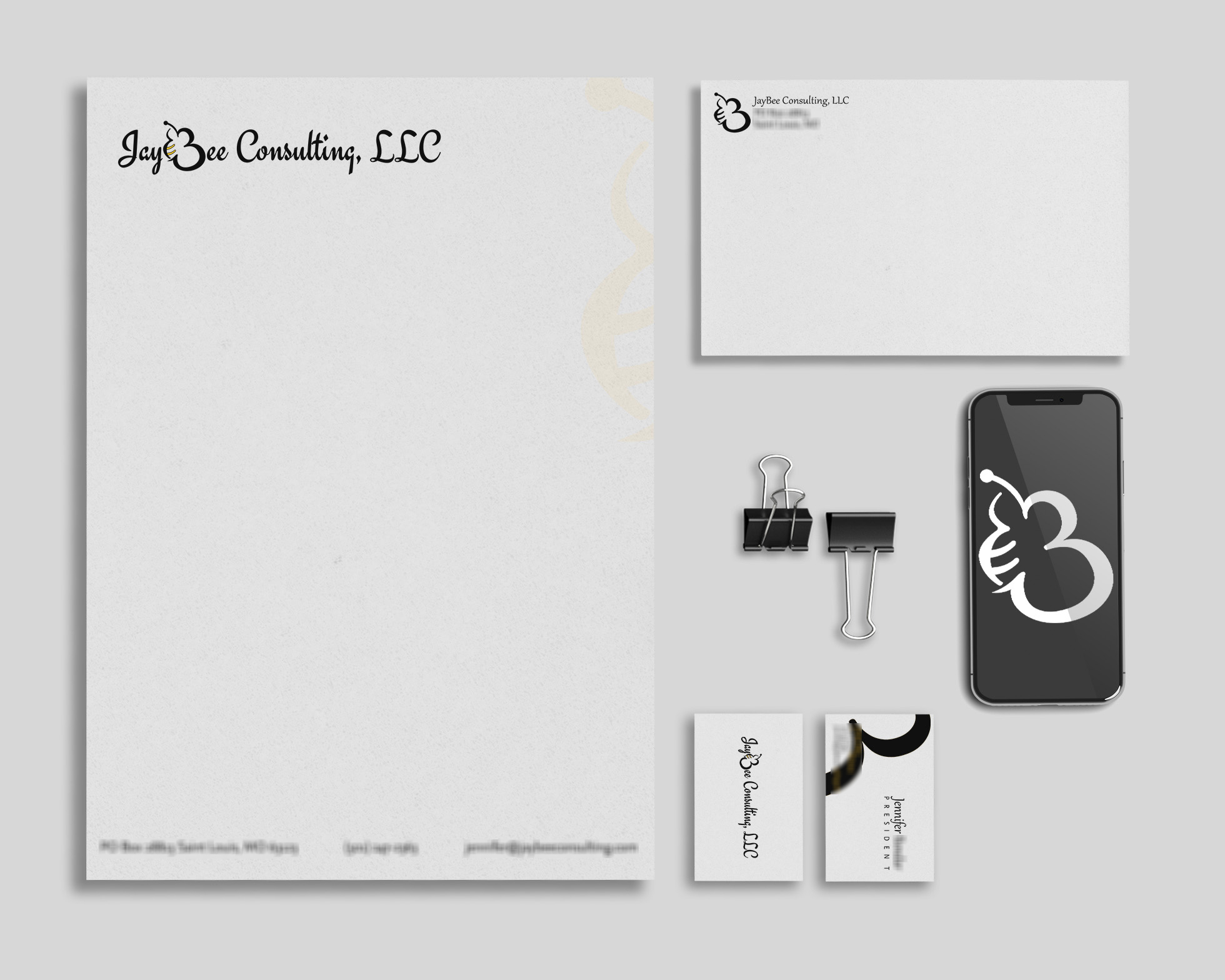 jaybee consulting stationary mockup with blurred sections for sensitive information
